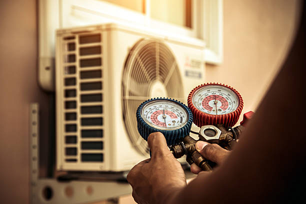 Professional Air Conditioning Service technician working in Wilson, AR